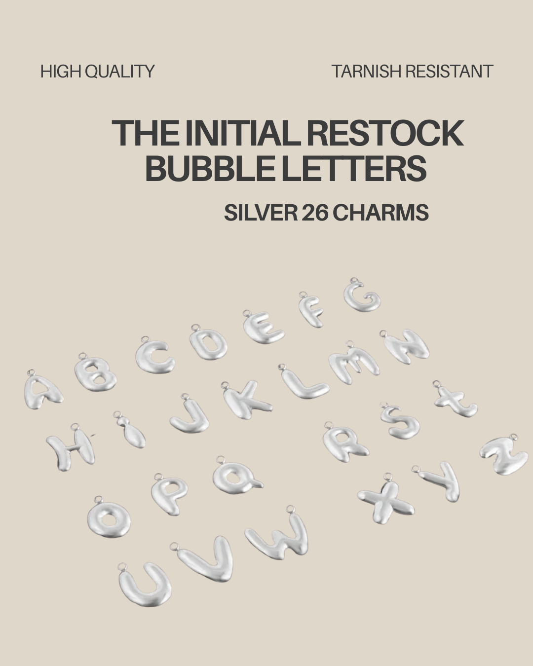 The initial restock bubble letters in gold and silver