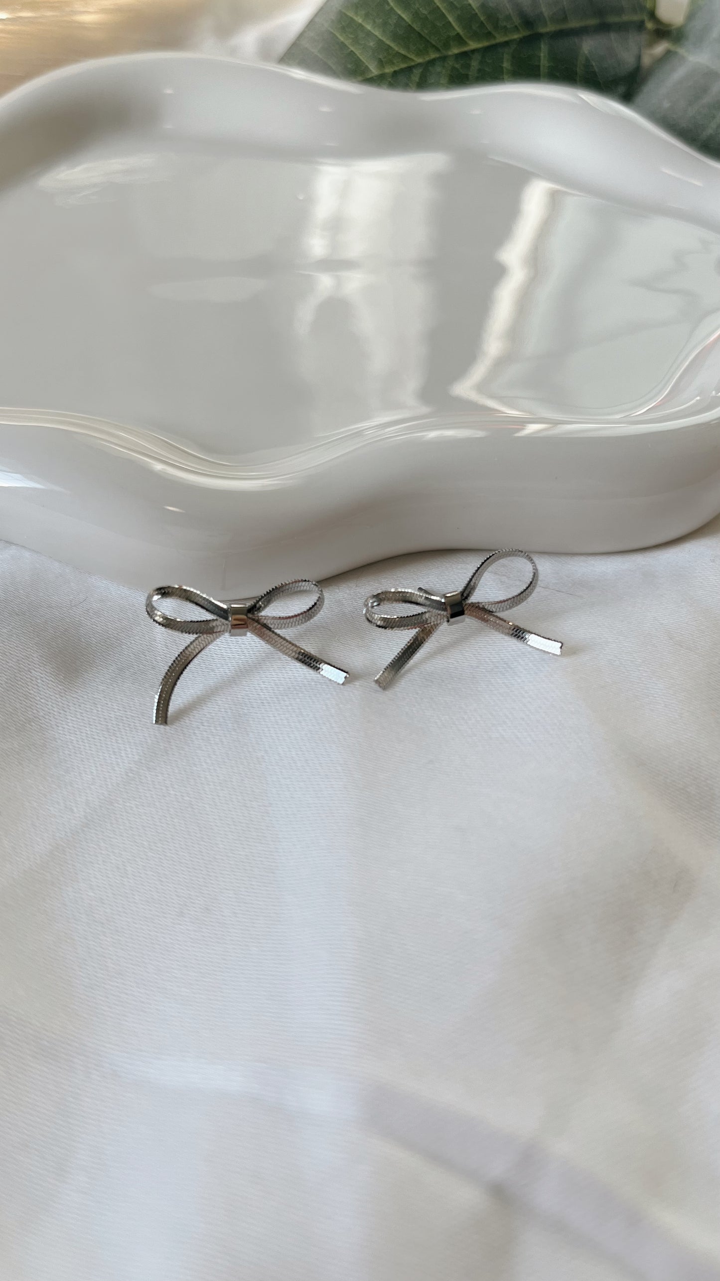 Silver ribbon bow studs