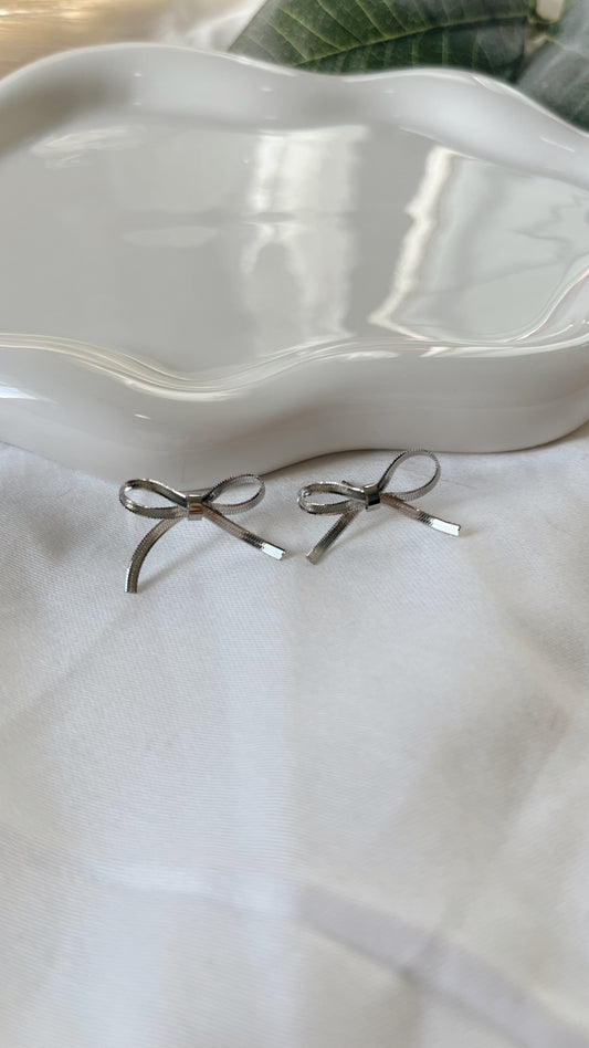 Silver ribbon bow studs