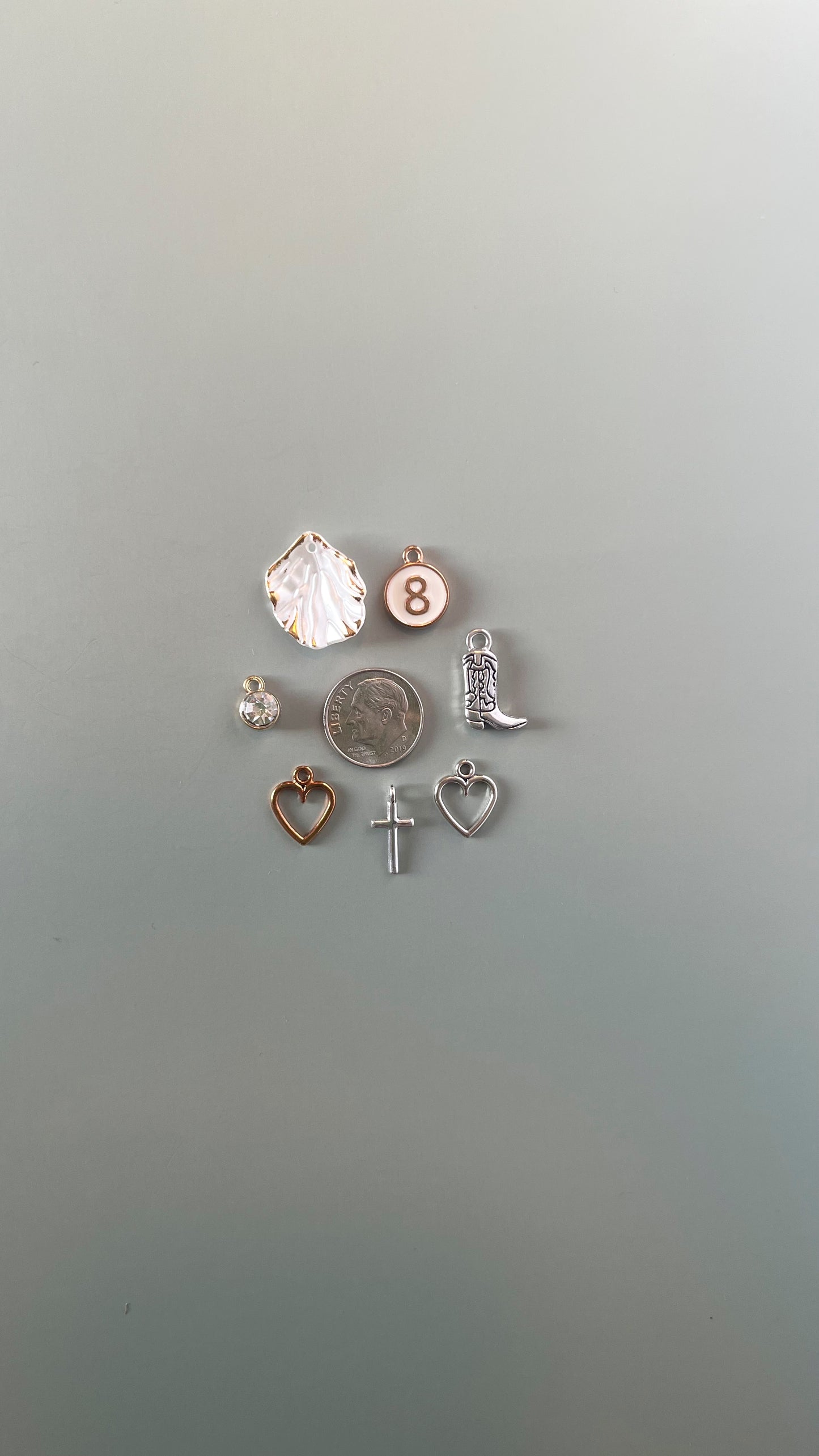 Assorted mixed metal charms in gold and silver