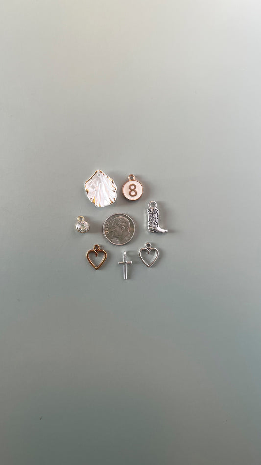 Assorted mixed metal charms in gold and silver