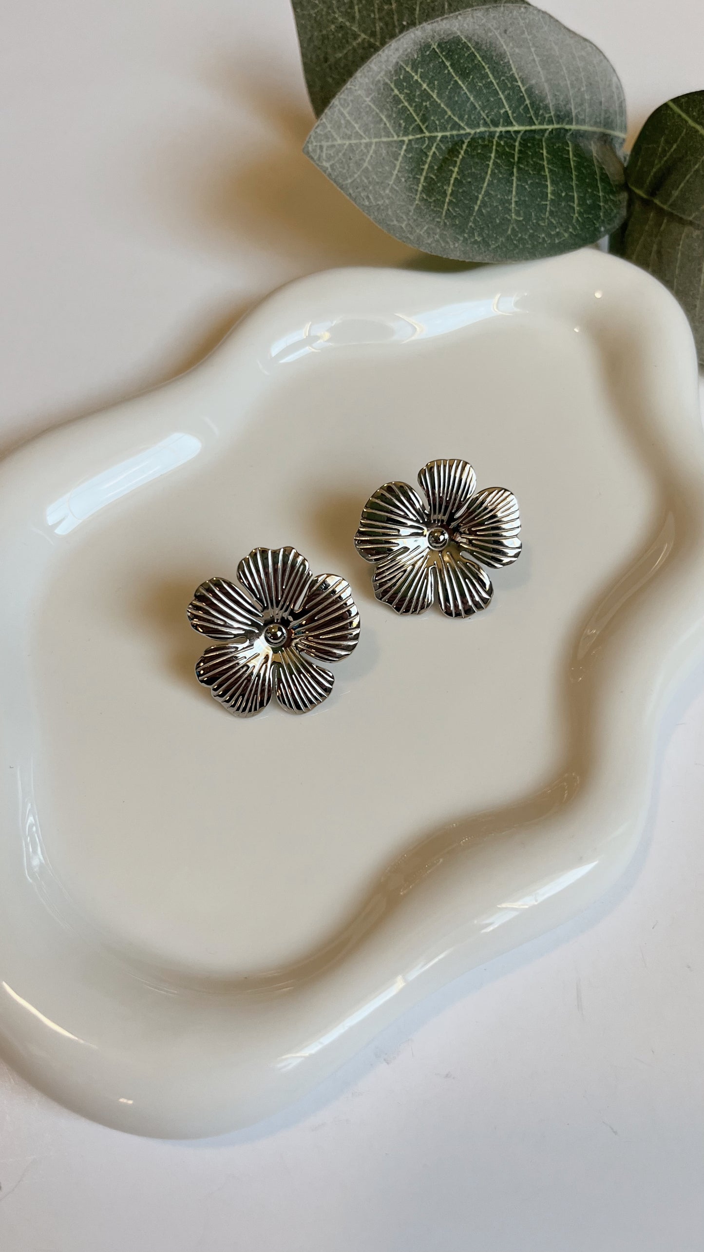 Silver flower statement studs