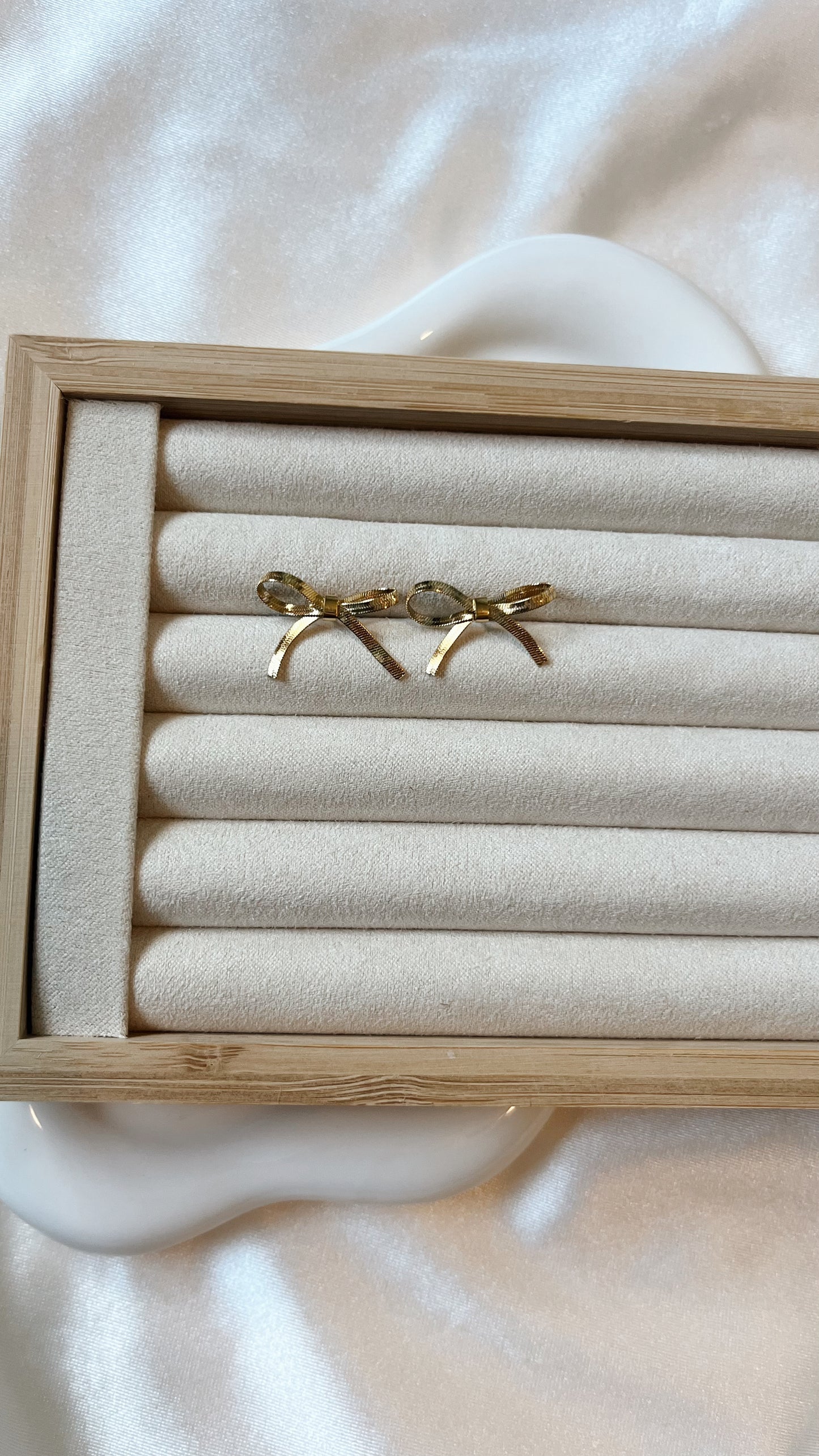 Gold ribbon bow studs